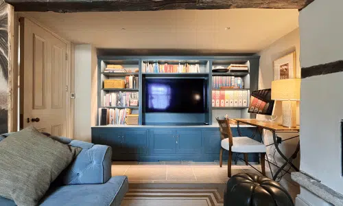 Dark blue media unit around tv